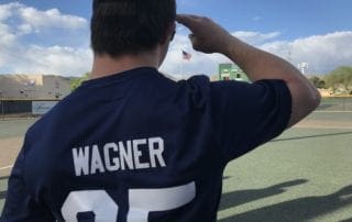A man wearing a t - shirt with the word wagner on it.