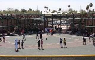 A group of people playing baseball on a baseball field.