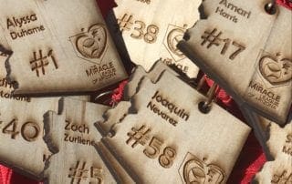 A group of wooden tags with numbers on them.