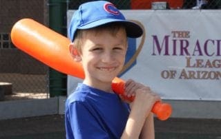 A boy holding a baseball bat.