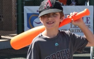 A boy holding a baseball bat.