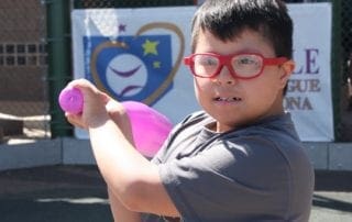 A boy holding a frisbee.