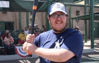 A man holding a baseball bat.