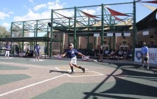 A man swinging a bat at a baseball game.