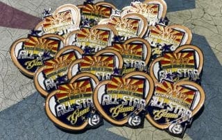 A group of pins with the arizona all star logo on them.