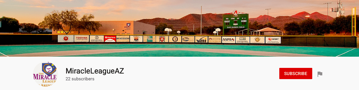 A baseball field with mountains in the background.