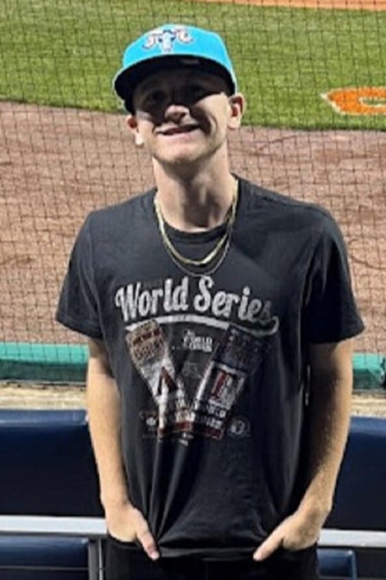 Man in World Series shirt smiling.